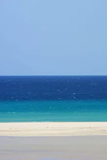 Sandy beach and bright blue ocean, Fuerteventura, Canary Islands. April 2013 Sandy beach and bright blue ocean, Fuerteventura, Canary Islands. April 2013