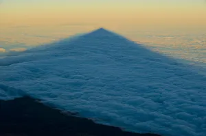 Shadow of the Teide volcano in sea of clouds at sunset, Teide National Park, Tenerife Shadow of the Teide volcano in sea of clouds at sunset, Teide National Park, Tenerife