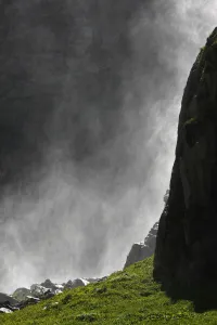 Spray from a waterfall in Amanauz Valley near Dombay, Teberdinsky biosphere reserve Spray from a waterfall in Amanauz Valley near Dombay, Teberdinsky biosphere reserve