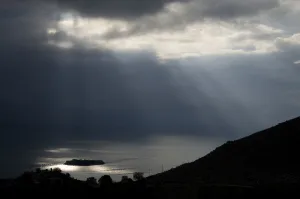 Sun shining through clouds over Lake Skadar near Murici, Lake Skadar National Park Sun shining through clouds over Lake Skadar near Murici, Lake Skadar National Park