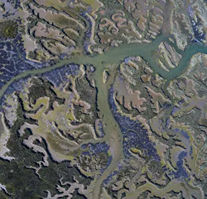 Tidal marsh at low tide, aerial view. Santona, Victoria and Joyel Marshes Natural Park Tidal marsh at low tide, aerial view. Santona, Victoria and Joyel Marshes Natural Park