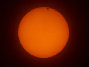 The transit of Venus across the face of the sun, with visible sunspots The transit of Venus across the face of the sun, with visible sunspots