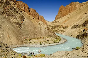 Tsarap River with pale blue water from glacial melt, and surrounding valley Tsarap River with pale blue water from glacial melt, and surrounding valley