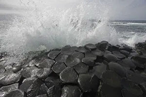 Wave crashing onto basalt rocks, Giants Causeway, Unesco Heritage Site, Northern Ireland Wave crashing onto basalt rocks, Giants Causeway, Unesco Heritage Site, Northern Ireland