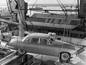 1962 Jaguar MkX being loaded on to Saxonia ship at Southampton docks for export. Creator: Unknown 1962 Jaguar MkX being loaded on to Saxonia ship at Southampton docks for export. Creator: Unknown