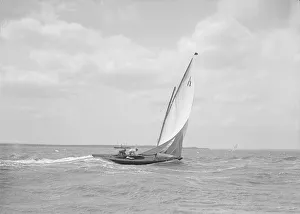 Sailboat Racing In The 1910s Prints: The 6 Metre class Ejnar sailing downwind, 1911. Creator: Kirk & Sons of Cowes