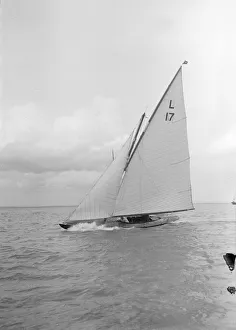 The 6 Metre Ejnar (L17) breaking waves, 1912. Creator: Kirk & Sons of Cowes The 6 Metre Ejnar (L17) breaking waves, 1912. Creator: Kirk & Sons of Cowes