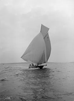 The 8 Metre class Antwerpia IV sailing under spinnaker, 1912. Creator: Kirk & Sons of Cowes The 8 Metre class Antwerpia IV sailing under spinnaker, 1912. Creator: Kirk & Sons of Cowes