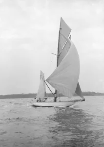 The 8-metre Ierne sailing with spinnaker, 1913. Creator: Kirk & Sons of Cowes The 8-metre Ierne sailing with spinnaker, 1913. Creator: Kirk & Sons of Cowes
