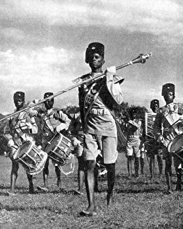 Bandsmen of the Northern Rhodesia Regiment beat a military tattoo, Zimbabwe, Africa, 1936 Bandsmen of the Northern Rhodesia Regiment beat a military tattoo, Zimbabwe, Africa, 1936