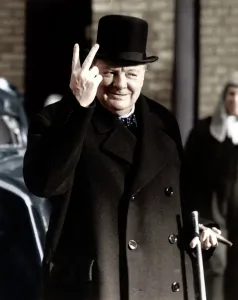 Prints of Winston Churchill making his famous V for Victory sign, 1942. A typical gesture of defiance from Britains wartime Prime Minister. (Colorised black and white print) United Kingdom Prints: Winston Churchill making V for Victory sign, 1942 Print