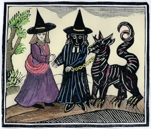 A black and a white witch with a devil animal A black and a white witch with a devil animal