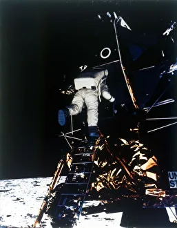 Buzz Aldrin descends from the Lunar Module, Apollo II mission, July 1969. Creator: Neil Armstrong Buzz Aldrin descends from the Lunar Module, Apollo II mission, July 1969. Creator: Neil Armstrong