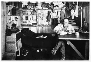 Herbert Ponting Photography Prints: Captain Scott Writing Up His Journal, c1911, (1928). Creator: Herbert Ponting