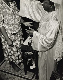 Contributions are made by all who receive the blessing and annointment... Washington, D.C. 1942. Creator: Gordon Parks Contributions are made by all who receive the blessing and annointment... Washington, D.C. 1942. Creator: Gordon Parks