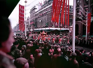 Prints of Coronation procession of Elizabeth II, London, 2nd June 1953. Crowds watching the passage of the Gold State Coach outside Lilley and Skinner's shoe store, Avon House, Oxford Street Westminster Prints: Coronation Procession Print, Elizabeth II, London 1953
