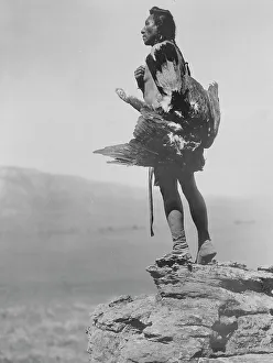 Black And White Bird Photos Prints: The eagle catcher, c1908. Creator: Edward Sheriff Curtis