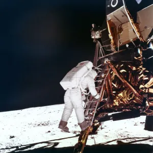Edwin Buzz Aldrin descends the steps of the Lunar Module ladder to walk on the Moon, 1969.Artist: NASA Edwin Buzz Aldrin descends the steps of the Lunar Module ladder to walk on the Moon, 1969.Artist: NASA