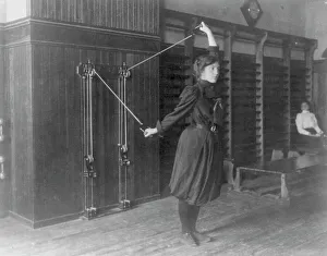 Female Student Exercising with Wall-Mounted Device Print
