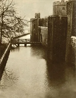 Prints of Flood waters in the moat at the Tower of London, 1928, (1935). The worst Thames flood within living memory...the Tower moat - ordinarily used as a football ground - filled with water Weather Prints: Flood Waters in the Tower of London Moat Print, 1928-1935