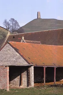 Glastonbury Tor Prints: GlastonburyTor and ancient Tithebarn in foreground