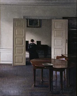 Interior with Ida Playing the Piano. Artist: Hammershoi, Vilhelm (1864-1916) Interior with Ida Playing the Piano. Artist: Hammershoi, Vilhelm (1864-1916)
