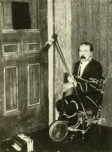 John Nevil Maskelyne performs a spirit cabinet illusion, c1910. Creator: Unknown John Nevil Maskelyne performs a spirit cabinet illusion, c1910. Creator: Unknown