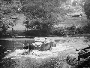 Black And White Car Images Prints: A Lancia Lambda being driven through water, c1925