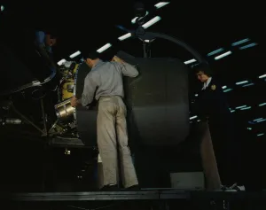Aeronautical Engineer Prints: Lowering an engine in place in assembling a C-87