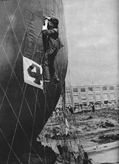 Vintage Air Transport Images Prints: Making adjustments to the net of a balloon before attaching the basket, c1935 (c1937)