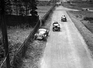 Brooklands Racing Circuit Prints: Two MG M types passing a broken down 1928 Alta Prototype