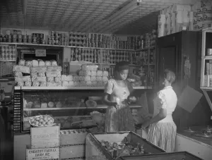 Mr. J. Benjamin's daughter waiting on a customer in her father's store, Washington, D.C. 1942 Mr. J. Benjamin's daughter waiting on a customer in her father's store, Washington, D.C. 1942