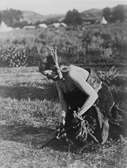 North American Ethnography Prints: Offering the pipe to the Earth-Cheyenne, c1910. Creator: Edward Sheriff Curtis