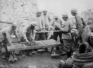 WWI Soldier Life Prints: Poilus making mattresses, between c1915 and c1918. Creator: Bain News Service