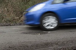 Pot Holes in Road Surface Print 2017