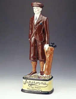 Pottery figure of a golfer advertising Superorna tailoring, 1920s Pottery figure of a golfer advertising Superorna tailoring, 1920s