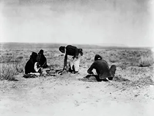 Indigenous People Portraits Prints: Preparing the sweat, c1905. Creator: Edward Sheriff Curtis