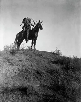Indigenous People History Prints: Ready for the charge-Apsaroke, c1908. Creator: Edward Sheriff Curtis