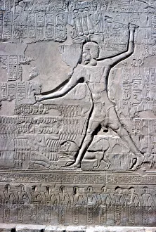 Ptolemaic Period Sculpture Prints: Detail of a relief of Pharaoh smiting his enemies
