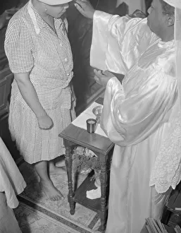 Reverend Clara Smith anointing a member of the St. Martin's Spiritual... Washington, D.C. 1942 Reverend Clara Smith anointing a member of the St. Martin's Spiritual... Washington, D.C. 1942