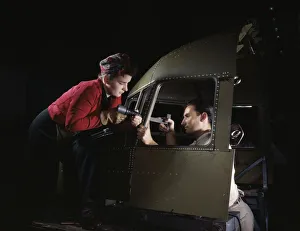 Women In Aviation Industry Prints: Riveting team working on the cockpit shell of a