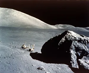 The Rover is dwarfed by a giant rock on the lunar surface, Apollo 17 mission, December 1972 The Rover is dwarfed by a giant rock on the lunar surface, Apollo 17 mission, December 1972