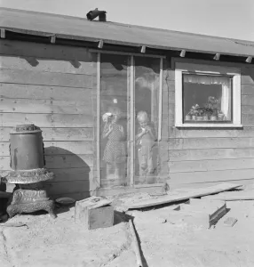 Two of the seven Browning children in doorway of their Oregon home, Dead Ox Flat, Oregon, 1939. Creator: Dorothea Lange Two of the seven Browning children in doorway of their Oregon home, Dead Ox Flat, Oregon, 1939. Creator: Dorothea Lange