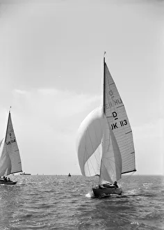 Kirk Sons Of Cowes Images Prints: Sloop (Dragon? class) sailing with spinnaker, c1938. Creator: Kirk & Sons of Cowes