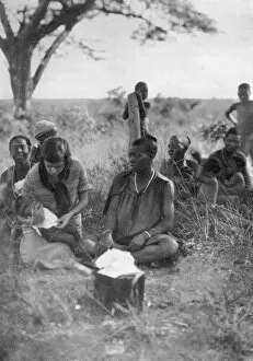 Bulawayo Collection: Stella Court Treatt tending a sick baby, Bulawayo to Dett, Southern Rhodesia, c1924-c1925 (1927)