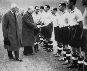 Winston Churchill greets the England football team, Wembley, London, October 1941.Artist: London News Agency Winston Churchill greets the England football team, Wembley, London, October 1941.Artist: London News Agency