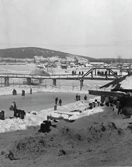 Ice Skating In Winter Prints: Winter bridge over river, between c1900 and c1930. Creator: Unknown