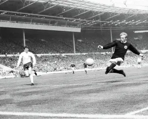 Prints of Denis Law in action for Scotland against England in 1967 at Wembley Scotland 3 England 2 Related Prints: Denis Law in action, Scotland v England 1967 Print