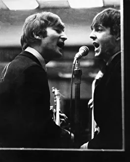 John Lennon and Paul McCartney in a recording studio John Lennon and Paul McCartney in a recording studio