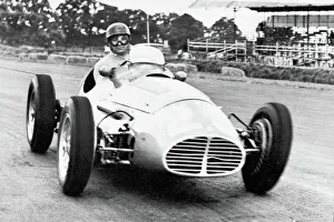 Juan Manuel Fangio driving a Maserati 1953 Juan Manuel Fangio driving a Maserati 1953